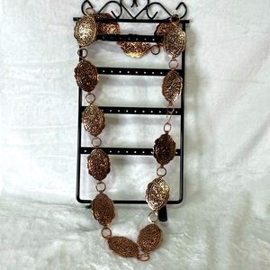 Copper color Concho belt or hat accessory. 36” long.